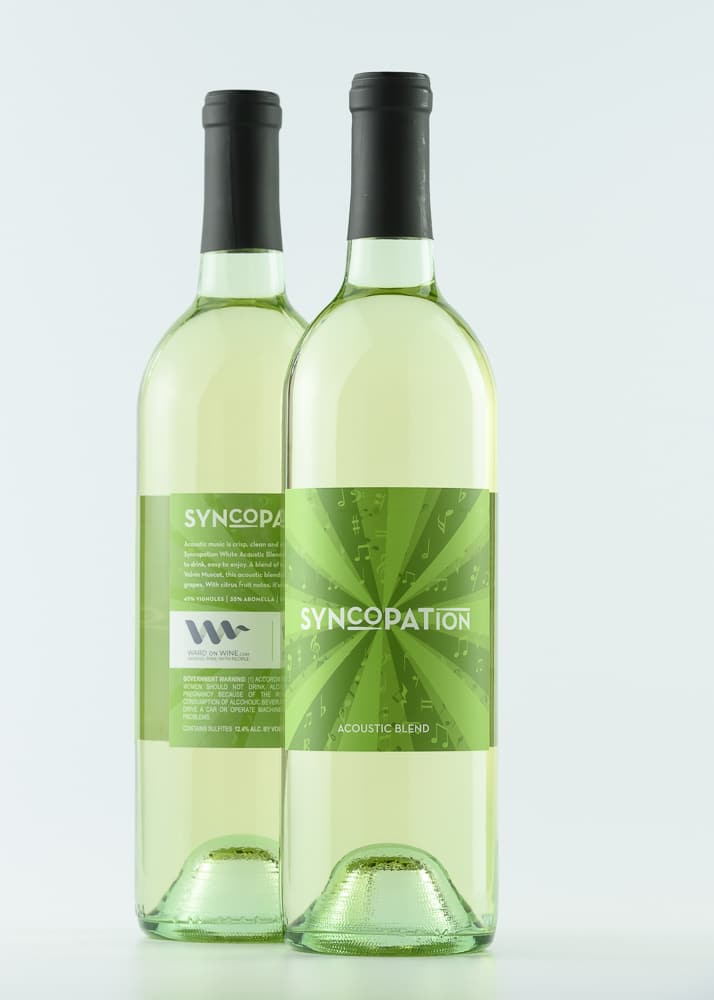 Acoustic Blend wine bottles on white background.